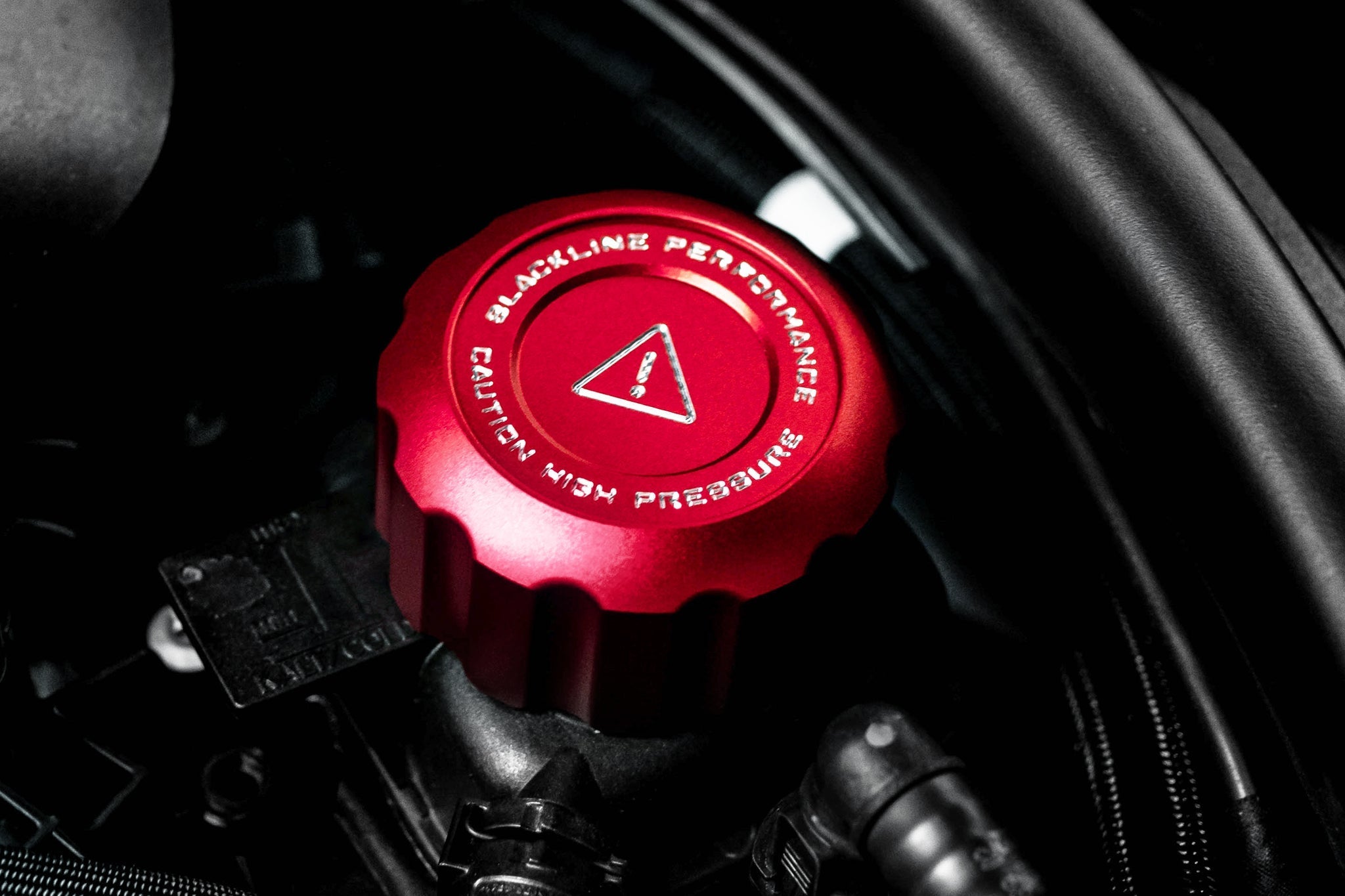 Close-up of Goldenwrench Charge Cooler Cap installed on S58 cap