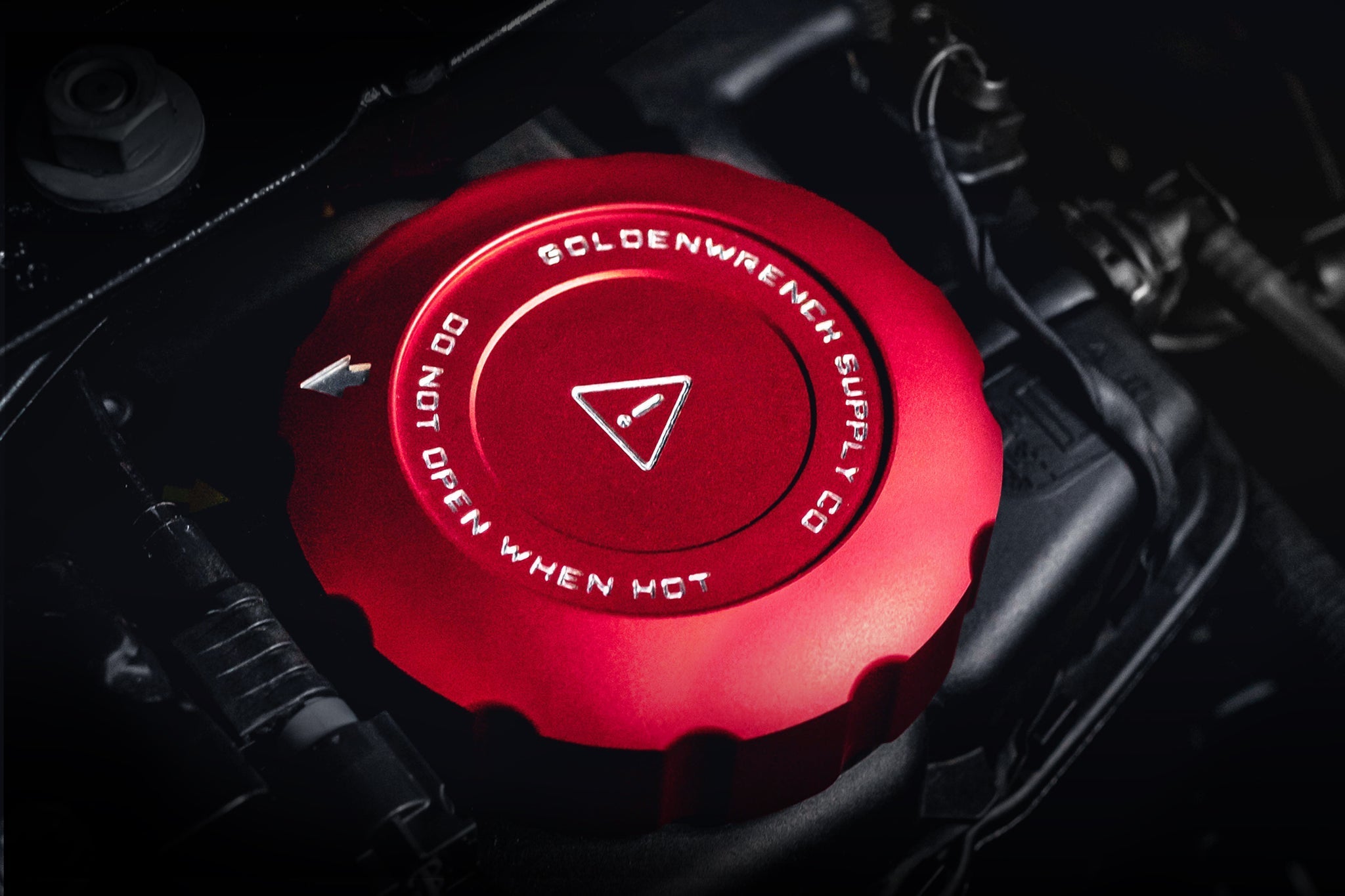 Close-up of Goldenwrench Coolant Cap installed on S58 cap