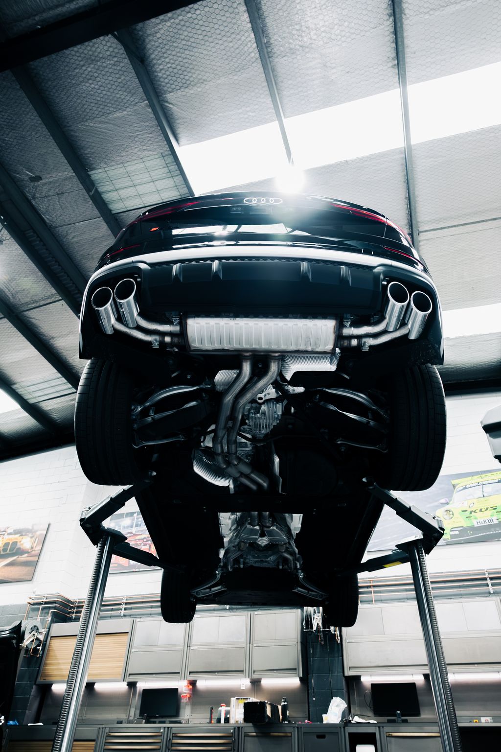 Audi SQ8 exhaust from under the car on the hoist