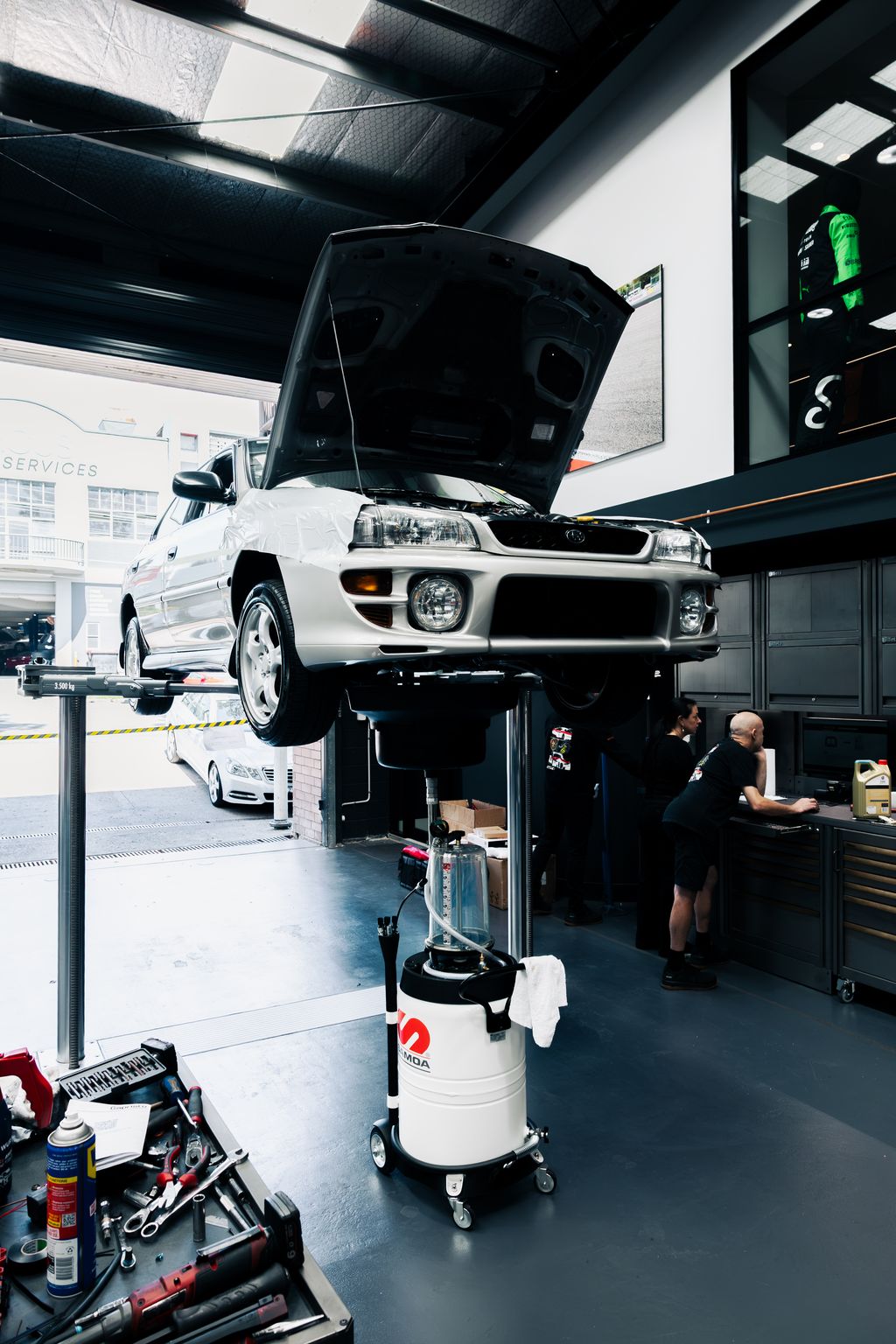 Subaru up on the hoist